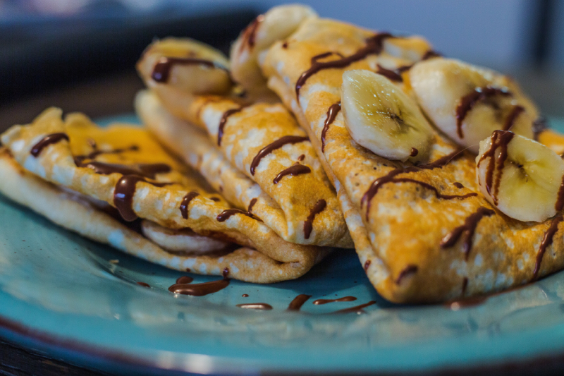 French crepes with banana and chocolate sauce